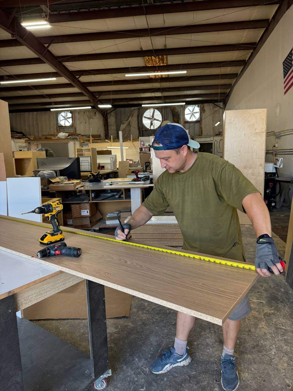 PalmCraft installer setting cabinets on site
