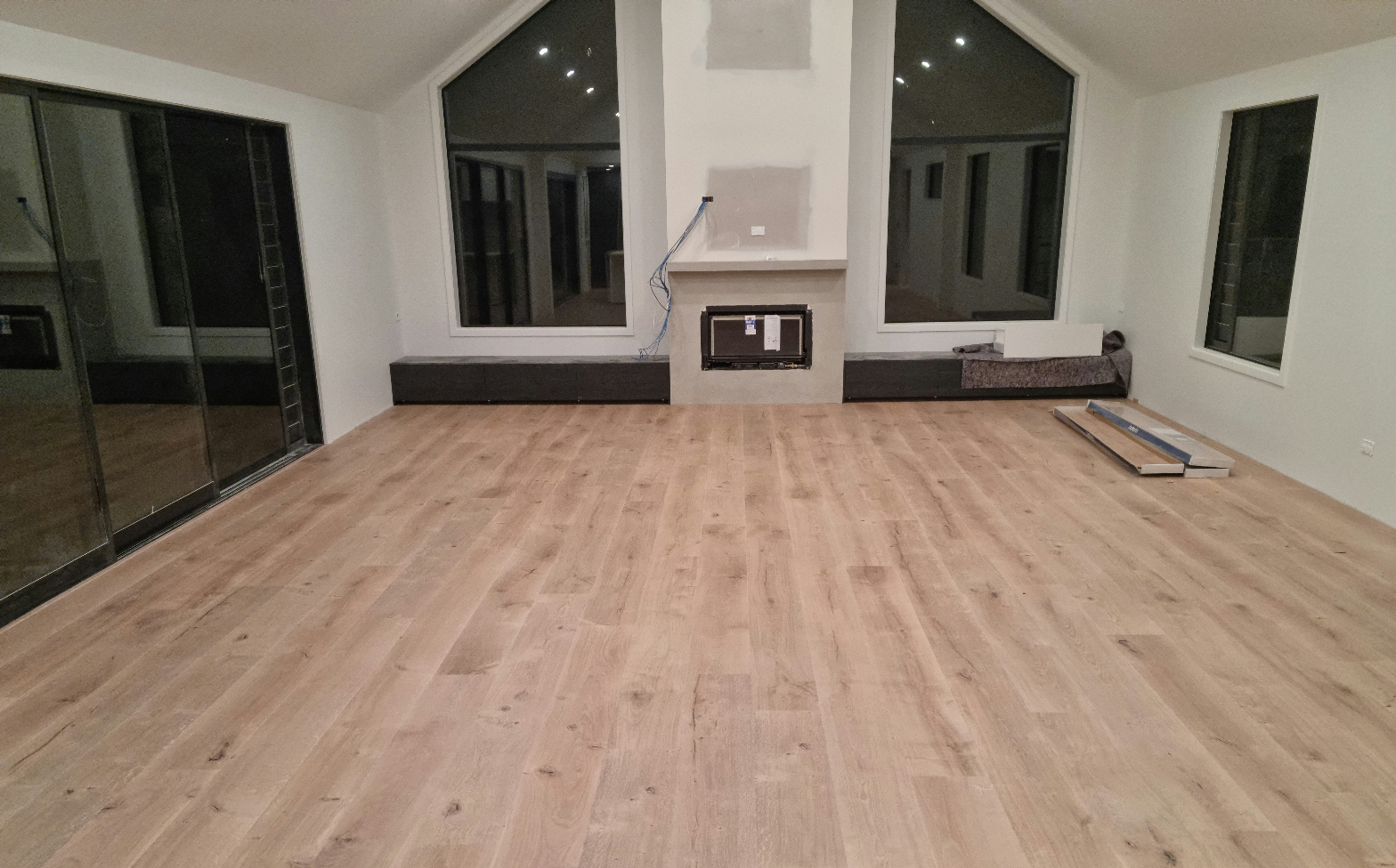 Laminate flooring freshly installed in a modern open-plan living room