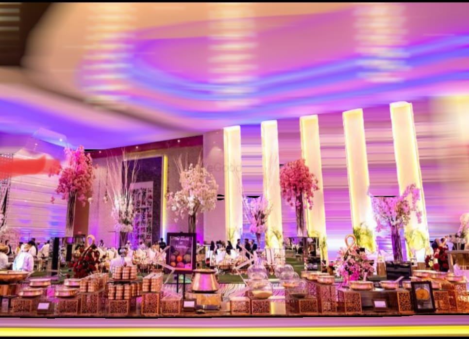 Grand wedding buffet hall setup with decorative lighting