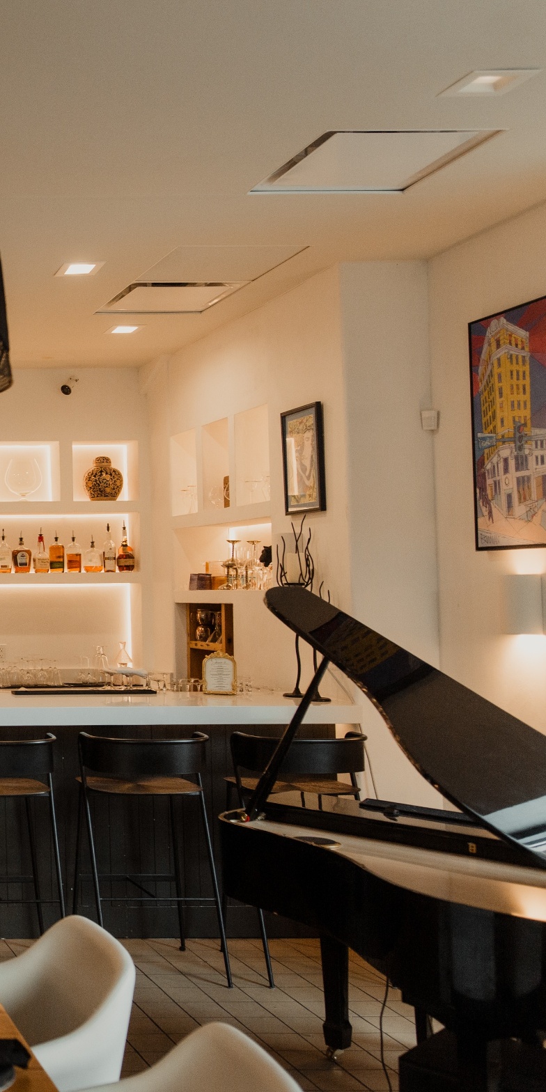 Piano and bar stools with colorful painting