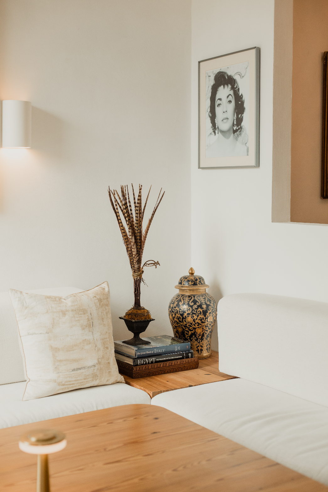 Lounge corner with Elizabeth Taylor portrait and ornate vase